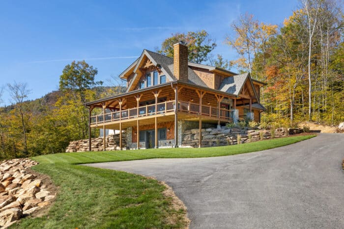 Custom log home with mountain setting, natural materials, and scenic views, perfect for a family ret.