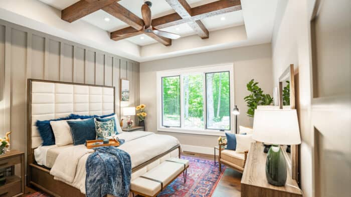 Elegant hybrid timber frame home interior with natural materials, bright windows, and scenic mountai.