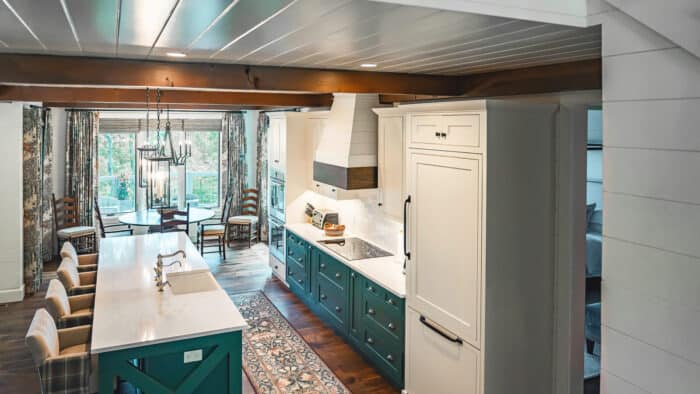 Elegant natural material kitchen in a custom mountain home with timber frame architecture and scenic.