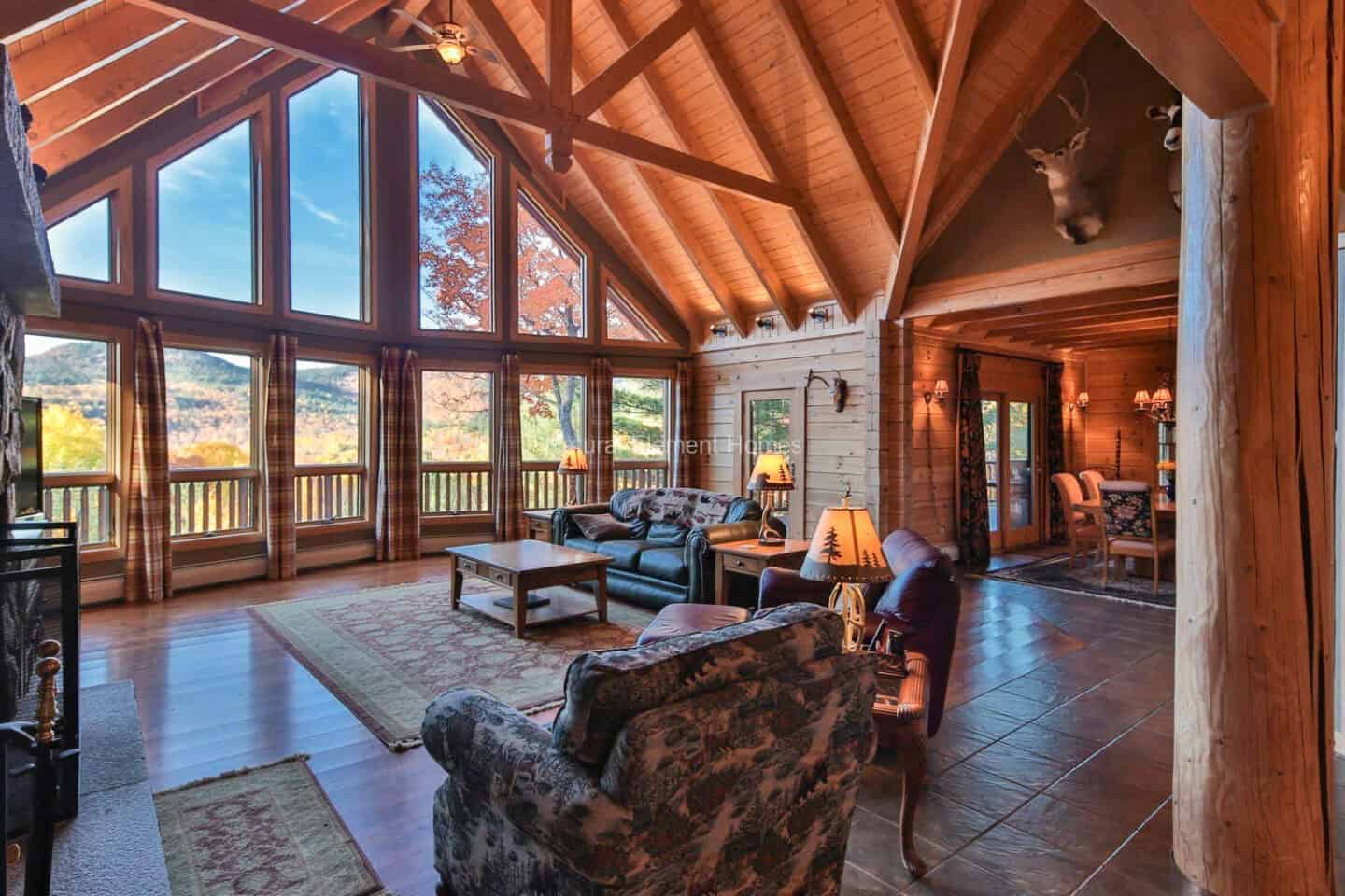 Elegant timber frame mountain home with natural materials and expansive windows showcasing scenic vi.