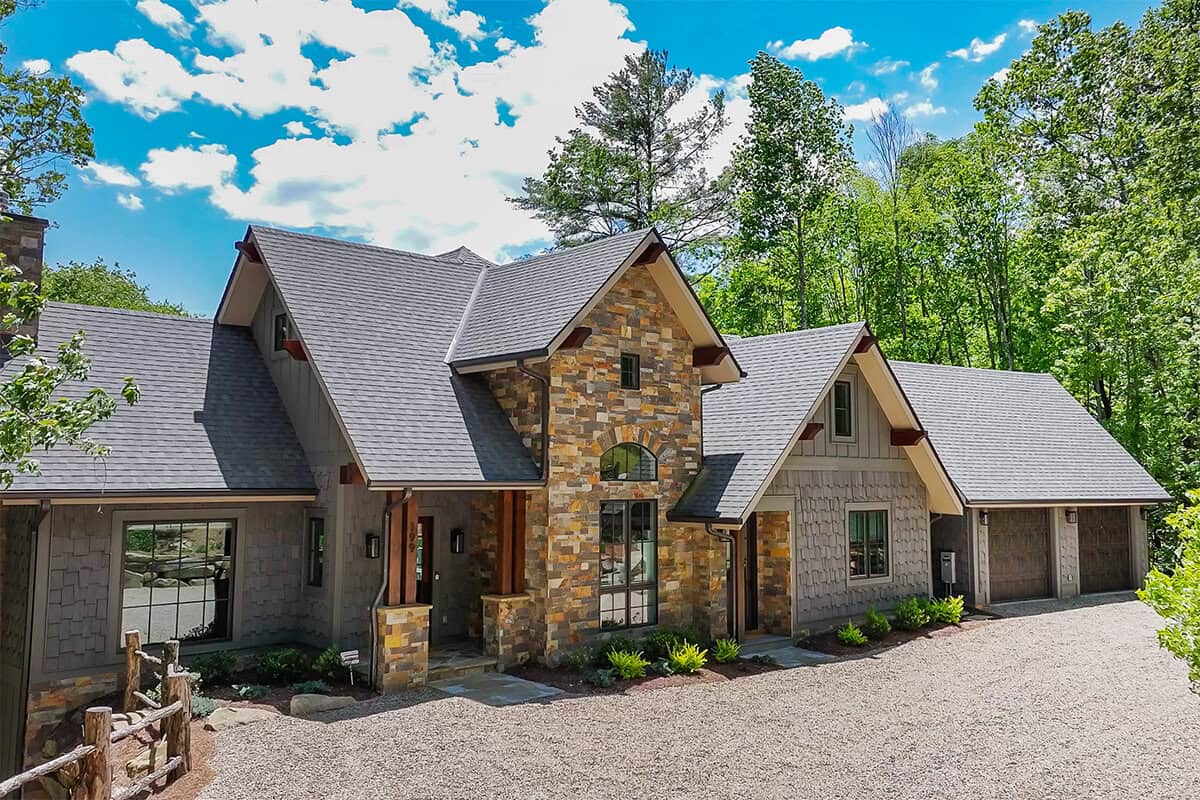 Custom log cabin home with natural materials in a mountain setting, hybrid timber frame design.