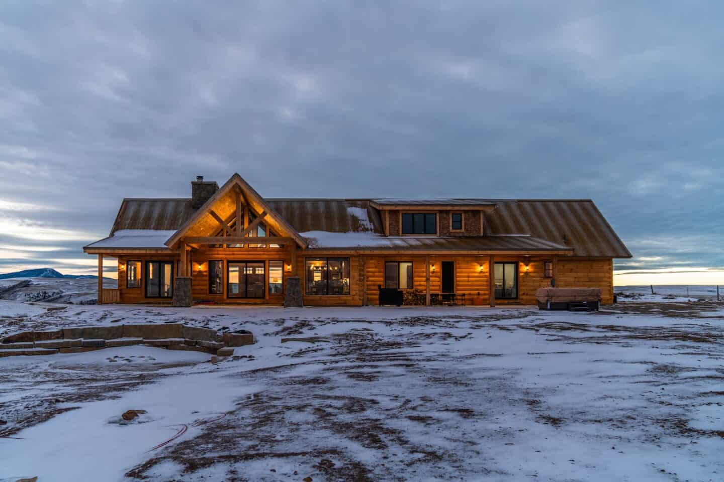 Luxury custom log home exterior — Natural Element Homes turnkey build